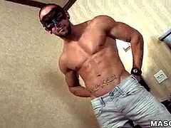 masked bulky fellow uses fleshlight on massive cock