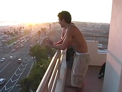 off the balcony for a wank