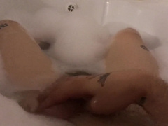 The man jacks off taking a tub with foam