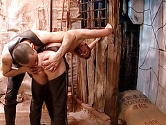 Bondage and spanking session in basement