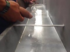 long heavy uncut cock pissing in public at trough urinal