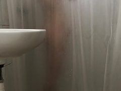 Naked twink showering