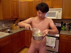 Naughty young guy prepares breakfast while stretching his tight ass with a butt-plug just for your pleasure