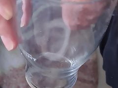 Piss in a glass in bathroom.