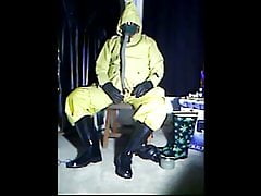Wanking in yellow rubber.