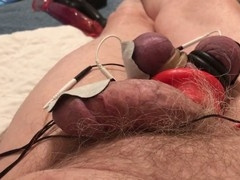 Extreme close-up cock and ball torture session with violet wand triggers precum