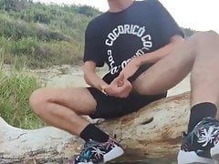Nice skinny dude busting a nut on the beach