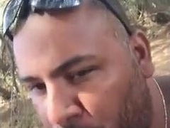 Bear Sucks and Swallows Outdoors