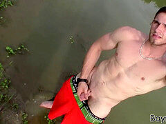 beefy jock Elijah Knight is peeing and undressing outdoors