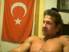 Steamy gay Turkish muscle hunk shows off his muscles