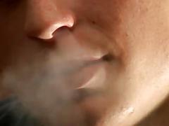 Horny twink strips nude while smoking and strokes his schlong
