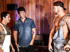 Two hung hunks fucking in a very atmospheric place