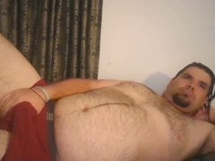 Chubby hairy man strokes himself until he cums