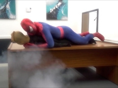 spiderman smashes robber he finds in an office