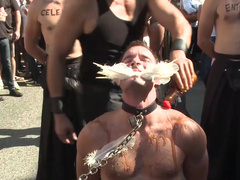 Submissive man lets his masters take advantage of him in public