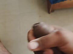 Brown man playing with his dick