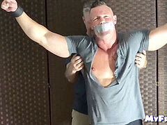 corded beefy dude suffers tickling from a mature deviant