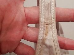 Dirty white string and dirty black panties laundries full sperm