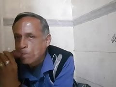 Indian older daddy sucking cock at gloryhole