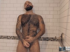 Muscular hairy man Atlas Grant masturbates solo in WOOLYTEDDY style