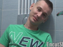 Short haired twink Patrick jerks off his uncut prick solo