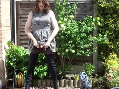 Sexy masturbating crossdresser in thigh boots outdoors 6