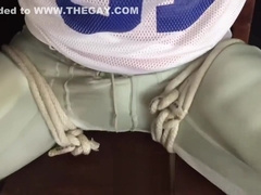 Football jock tied to chair and tape gagged - young man bound and gagged