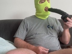 Choking on a massive black dildo