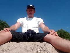 Pissing and jerking on a river bank