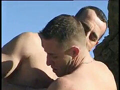 Outdoor gay act at the beach