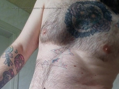 the hairy man has taken a bathtub and flashes us his ample fur covered trouser snake