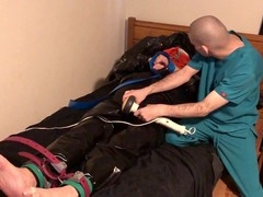 Rubber Boy in Leather Bondage