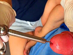 My wife Pia sticking an Urethra Chain into my bladder Part02