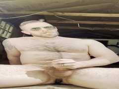 Rodrick Snow enjoys a cigar while exploring his backdoor with a speculum