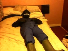 nip clamp ache in a boilersuit and sensory deprivation hood