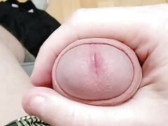 Guy jerking off uncircumcised cock on the table