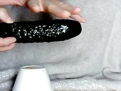 Dotted cucumber completely slides in my ass. Wow