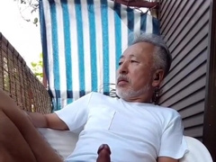 Chinese father have fun with a man meat in the summer garden,