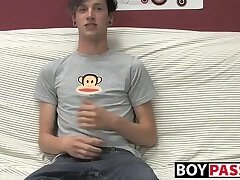 Adorable gay guy Danny jerks off his dick on couch solo
