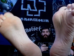 Bearded Metalhead Gamer Flashing Soles While Texting