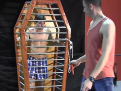 Caged boy is eager to experience his first maledom experience