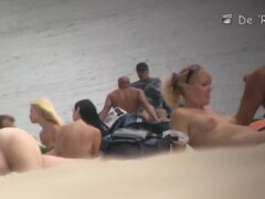 Blonde mature chick is naked at the beach