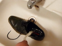 Piss in men's dress shoe