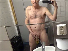 Pervert grandfather Ulf Larsen piss and masturbate in public toilets