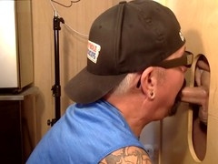 Mature queer at a gloryhole gives a deep blowjob until cumshot