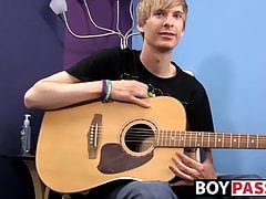 Young man plays guitar before dick stroking and cumming