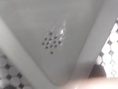 Faggot pissing in urinal and licking it up