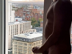 Exhib jerk off and cum over cityscape view.