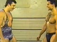Muscled wrestlers grapple naked in the boxing ring