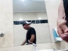 Hot guy plays with cock and gets naked at the mall restroom